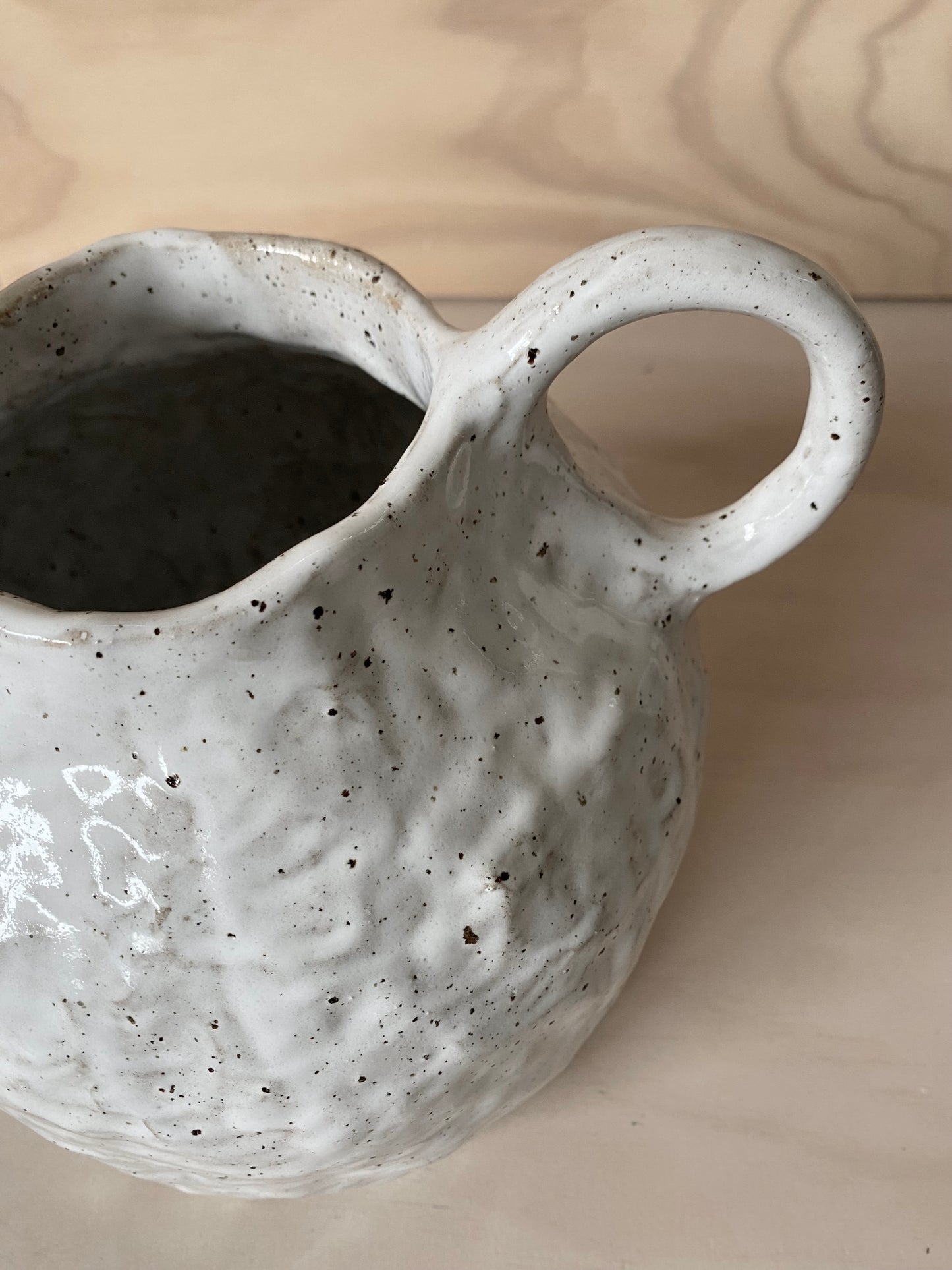 Speckled white vase